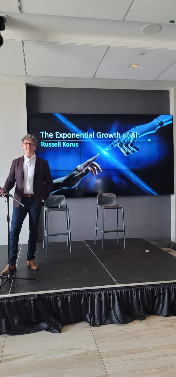 Russell Korus presenting The Exponential Growth of AI